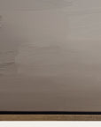 textured beige wall with a black strip at the bottom 