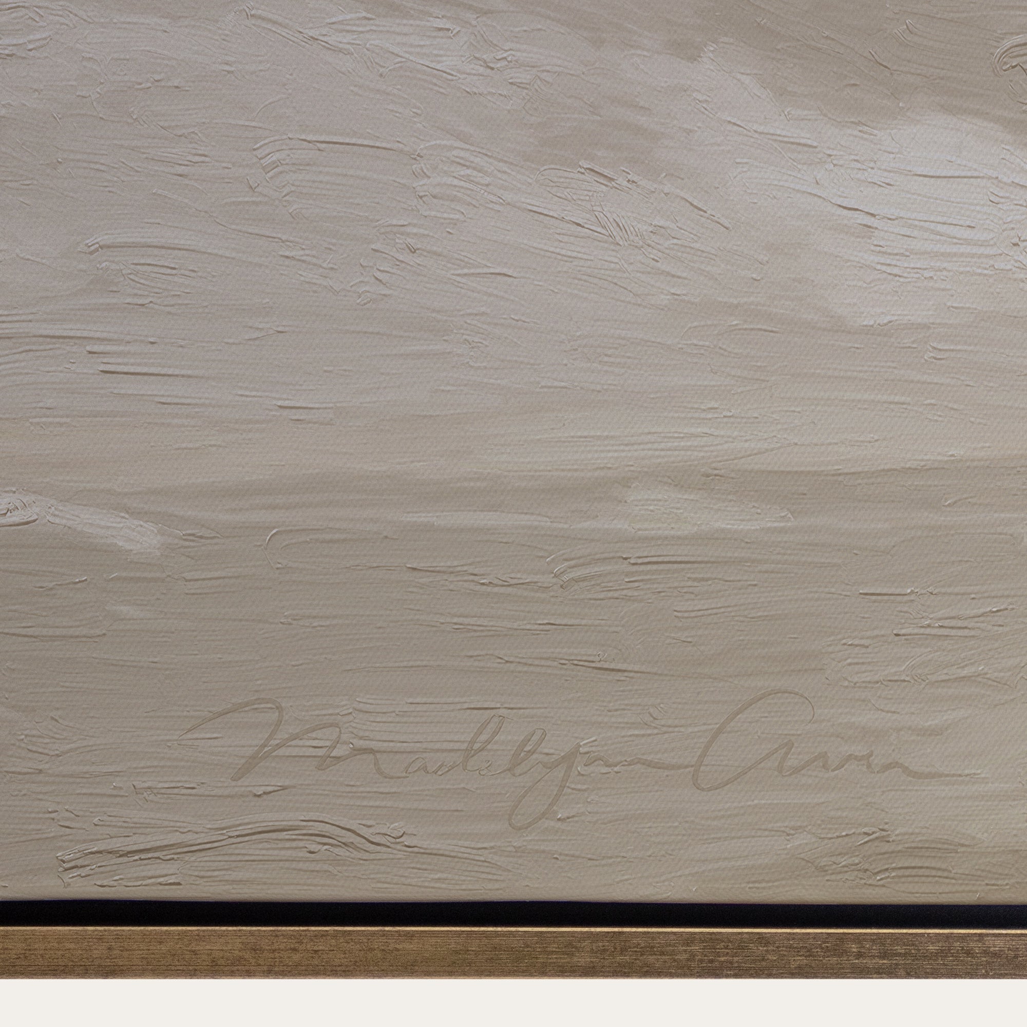 Textured beige surface with a signature at the bottom 