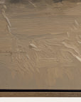 textured brown surface with a signature at the bottom left corner 