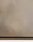 textured beige surface with a black strip at the bottom 