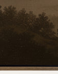 sepia-toned landscape with trees and a mountain range 