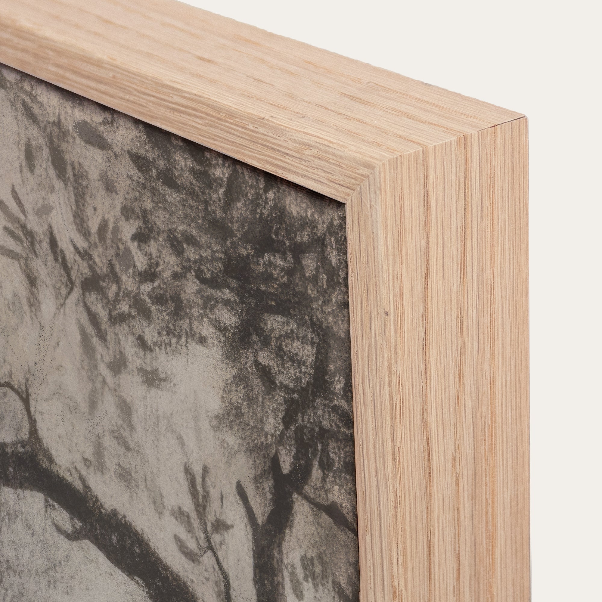 Close-up of a wooden picture frame with a textured background 