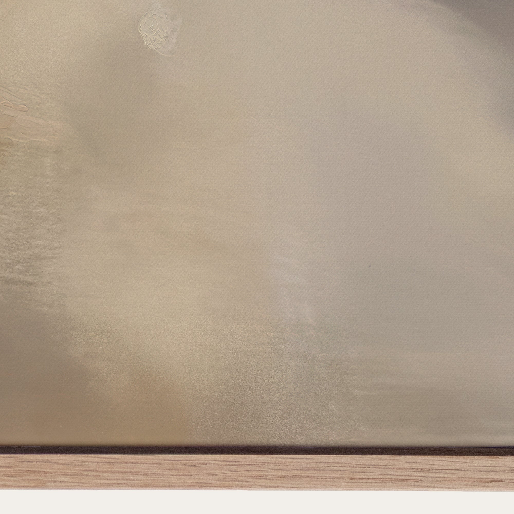 Close-up of a beige textured surface with a wooden base 