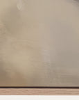 close-up of a beige textured surface with a wooden base 
