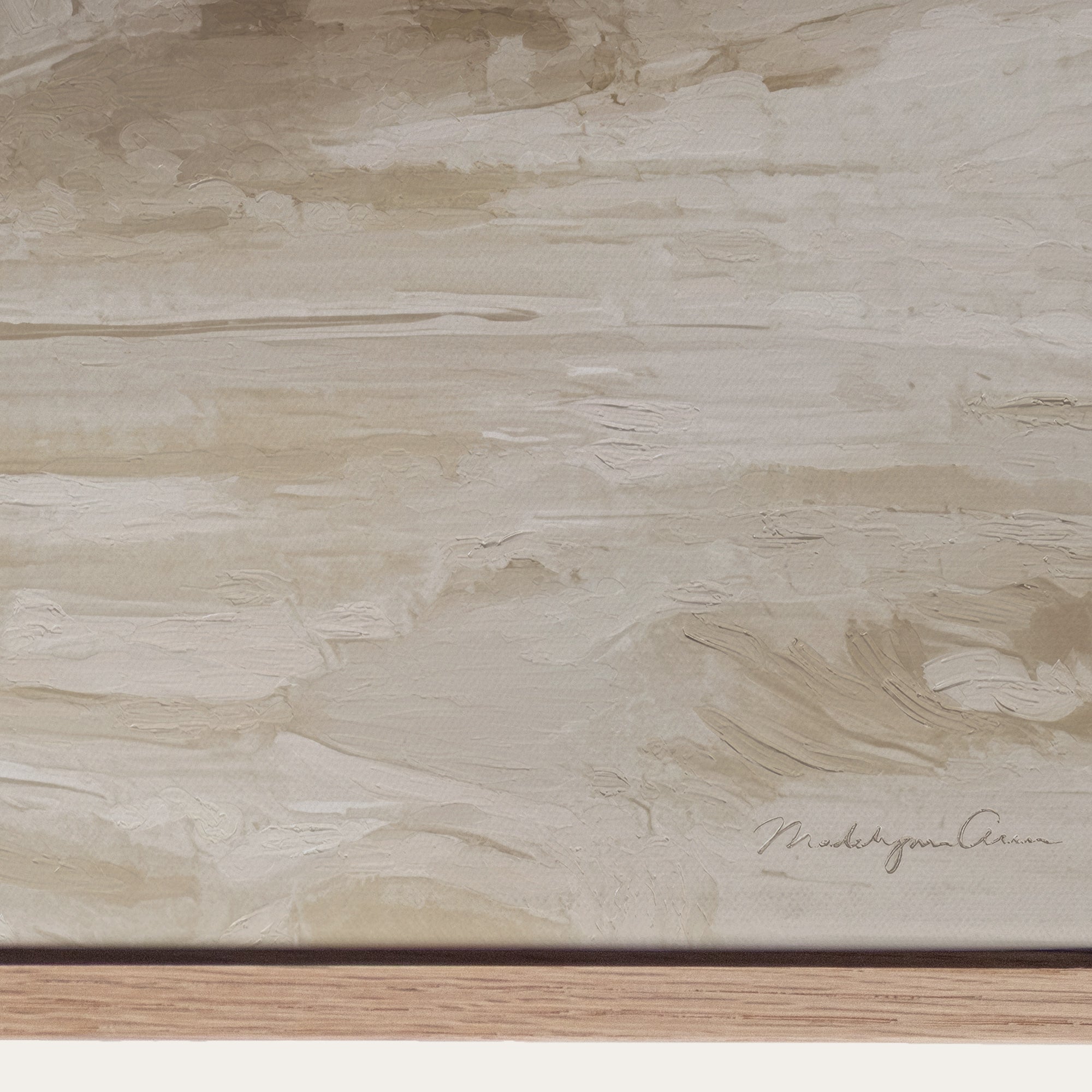 Textured beige surface with a signature at the bottom right corner 