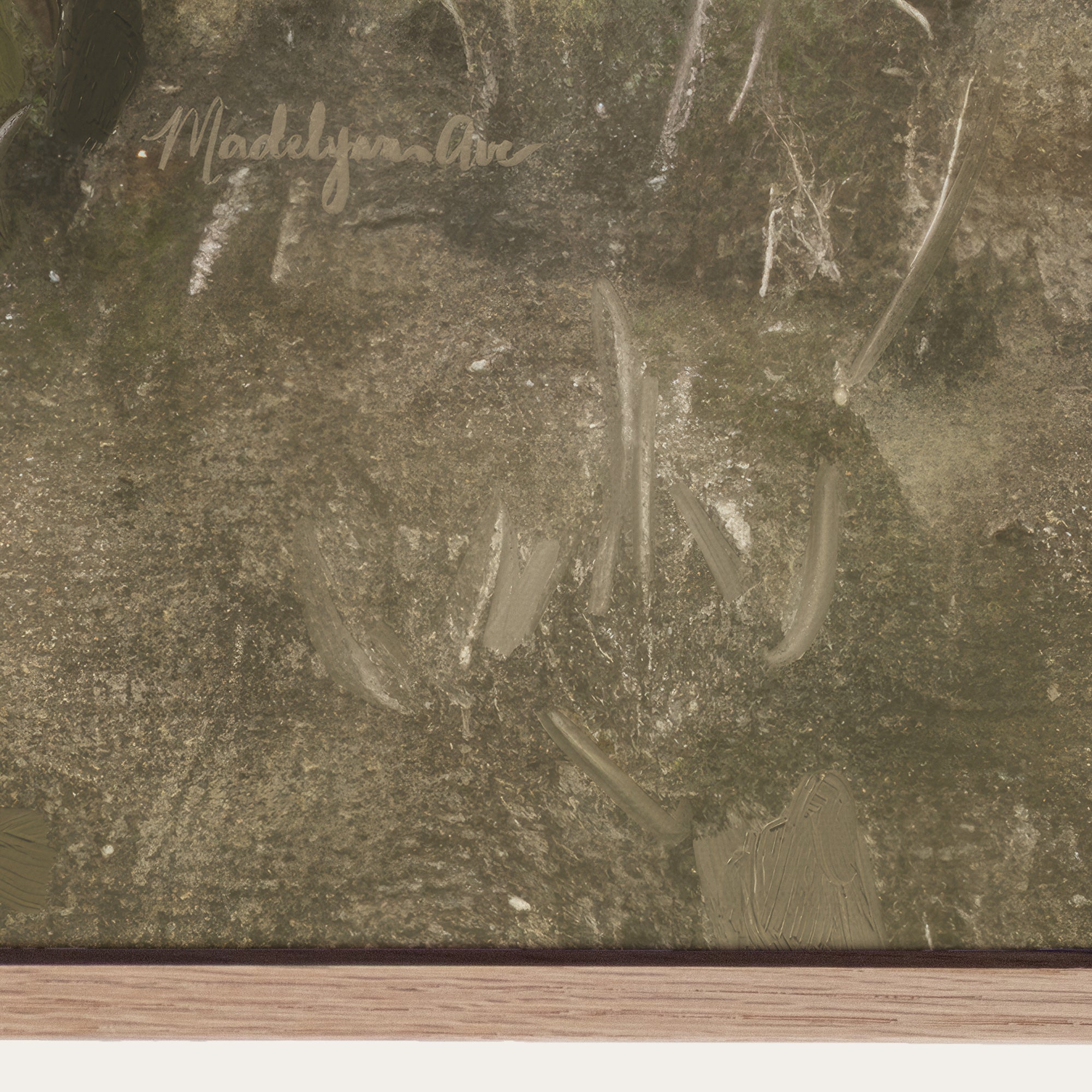 Close-up of a signature on a textured surface, likely a painting. 