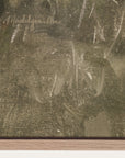 close-up of a signature on a textured surface, likely a painting. 