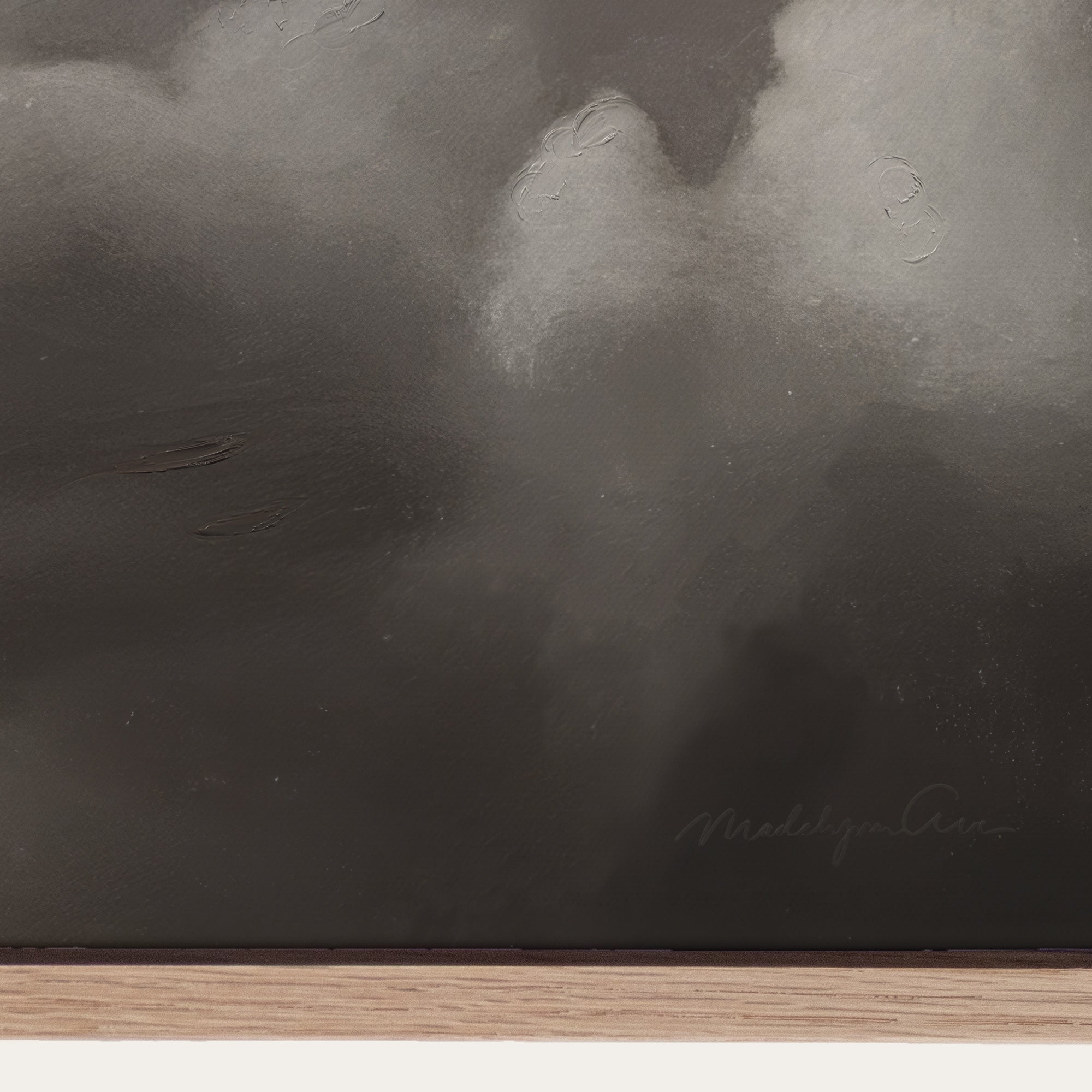 Abstract black and white painting with a signature at the bottom right corner. 