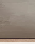 textured brown surface with a wooden base 