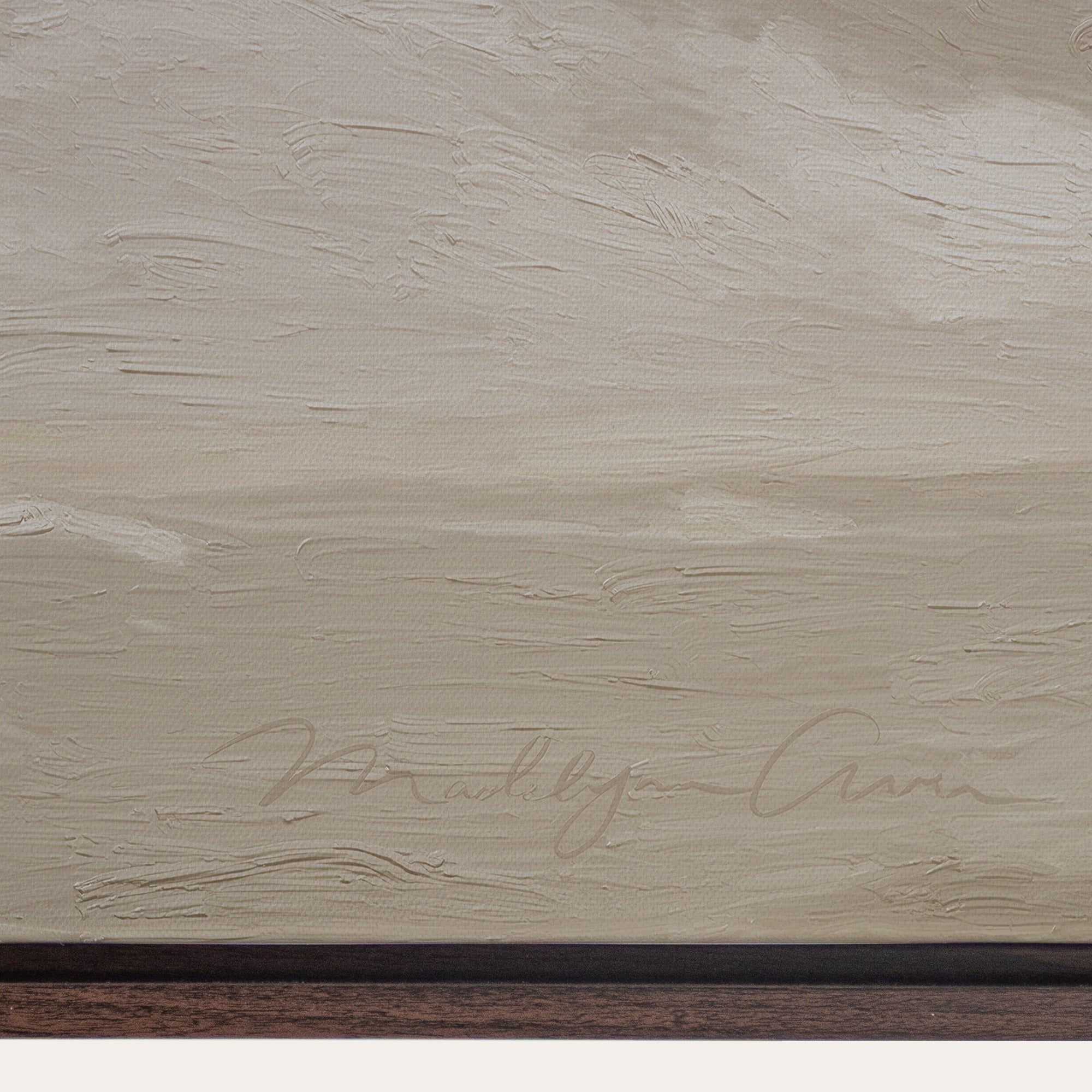 Textured beige surface with a signature at the bottom 