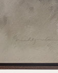 textured beige surface with a signature and wooden border 