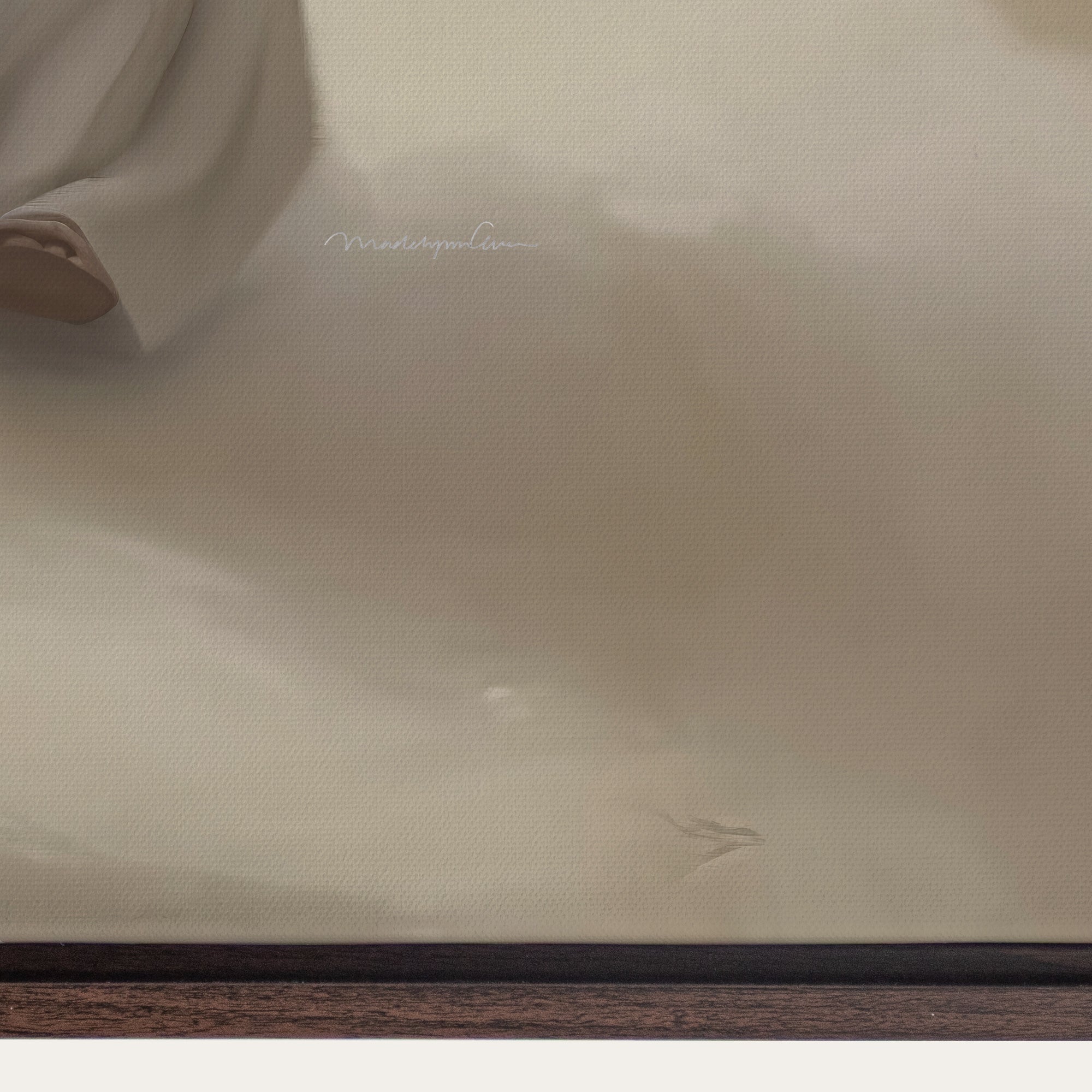 Close-up of beige fabric with a brand name on a wooden surface. 