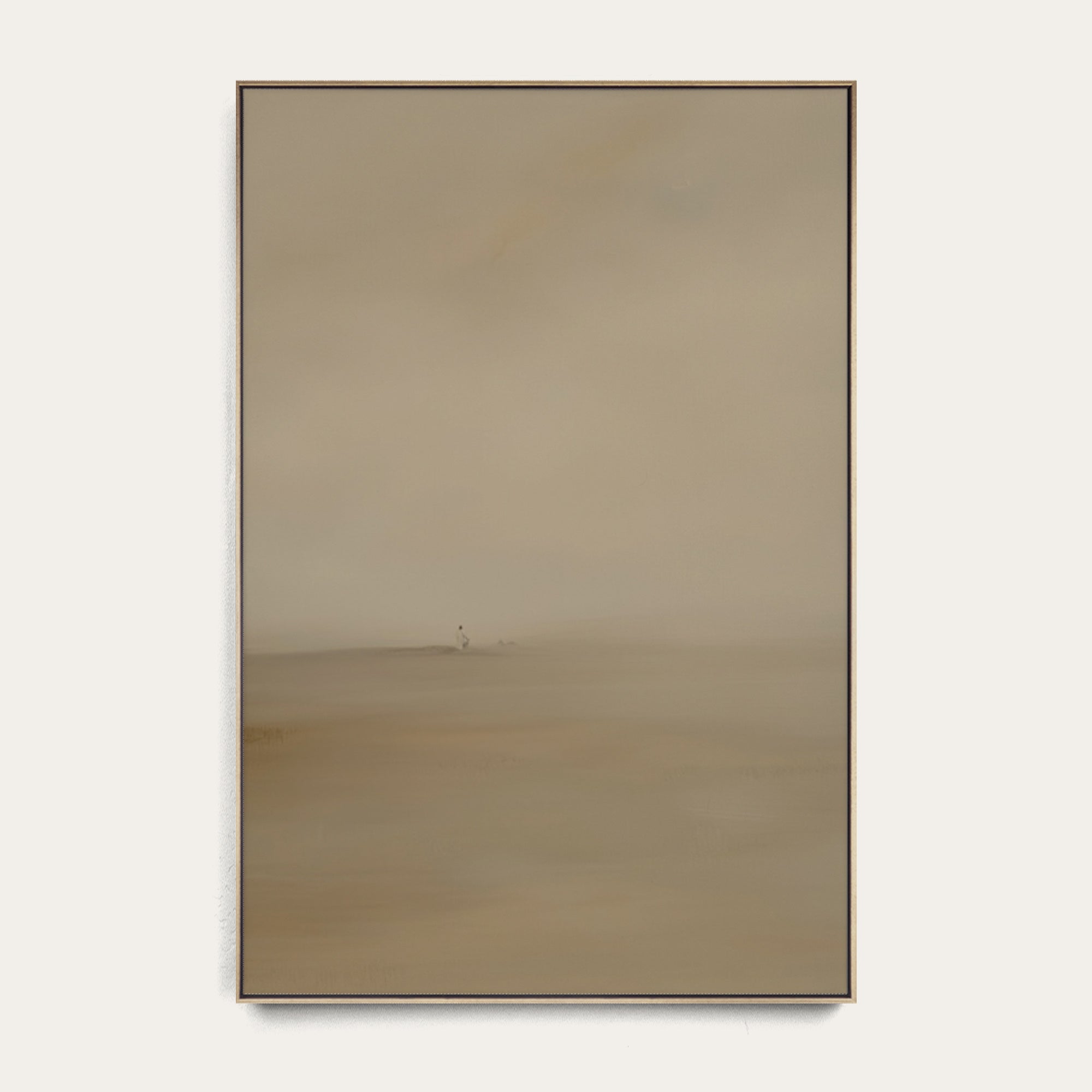 Rectangular mirror with a gold frame on a white wall 