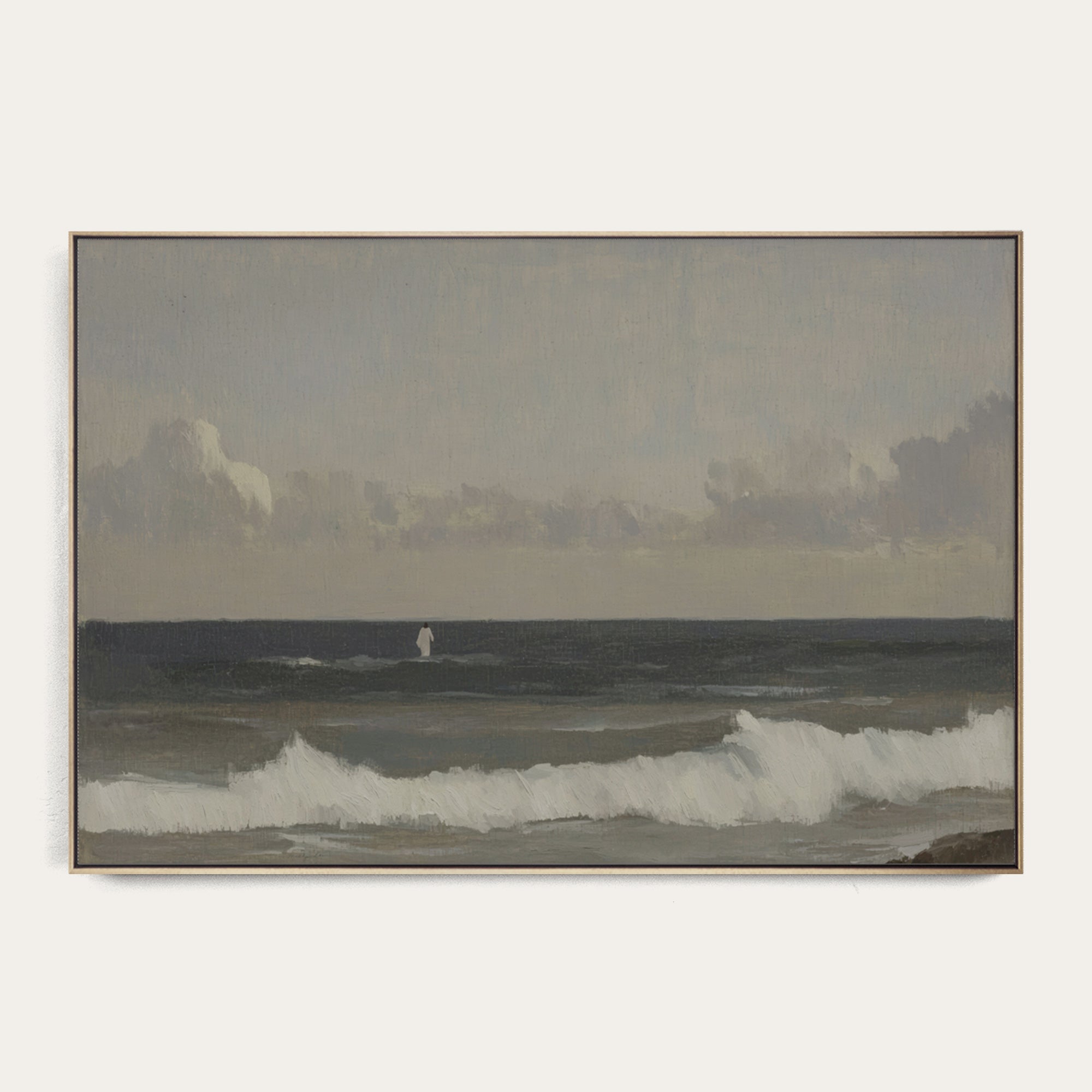 Framed artwork of a coastal scene with waves and a distant figure on a white background 
