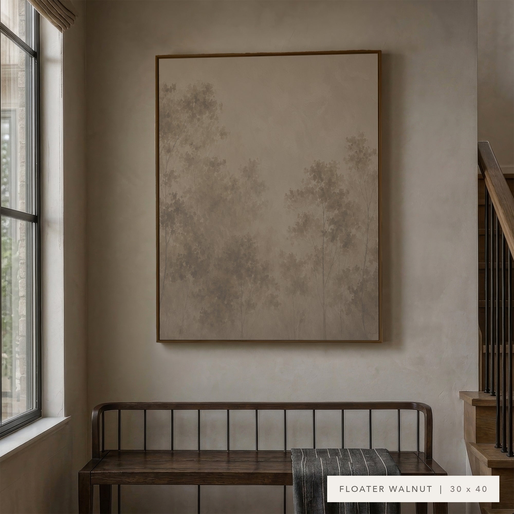 A large framed wall art print with a minimalist tree design in muted beige and gray tones, displayed in a real interior setting above a wooden bench, with a text label in the corner reading 'FLOATER WALNUT | 30 x 40'.