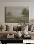 living room with beige sofa, decorative vases, and a framed landscape painting. 