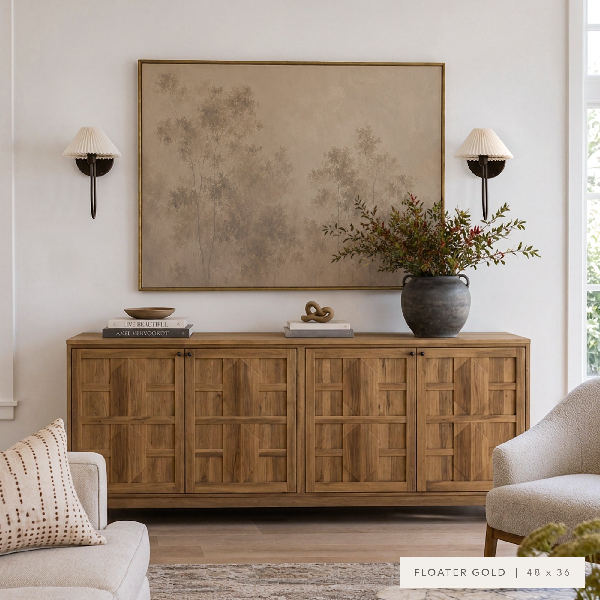 A large framed wall art print with a muted abstract tree design in warm beige and brown tones, displayed above a wooden credenza in a styled living room setting. __lifestyleImage