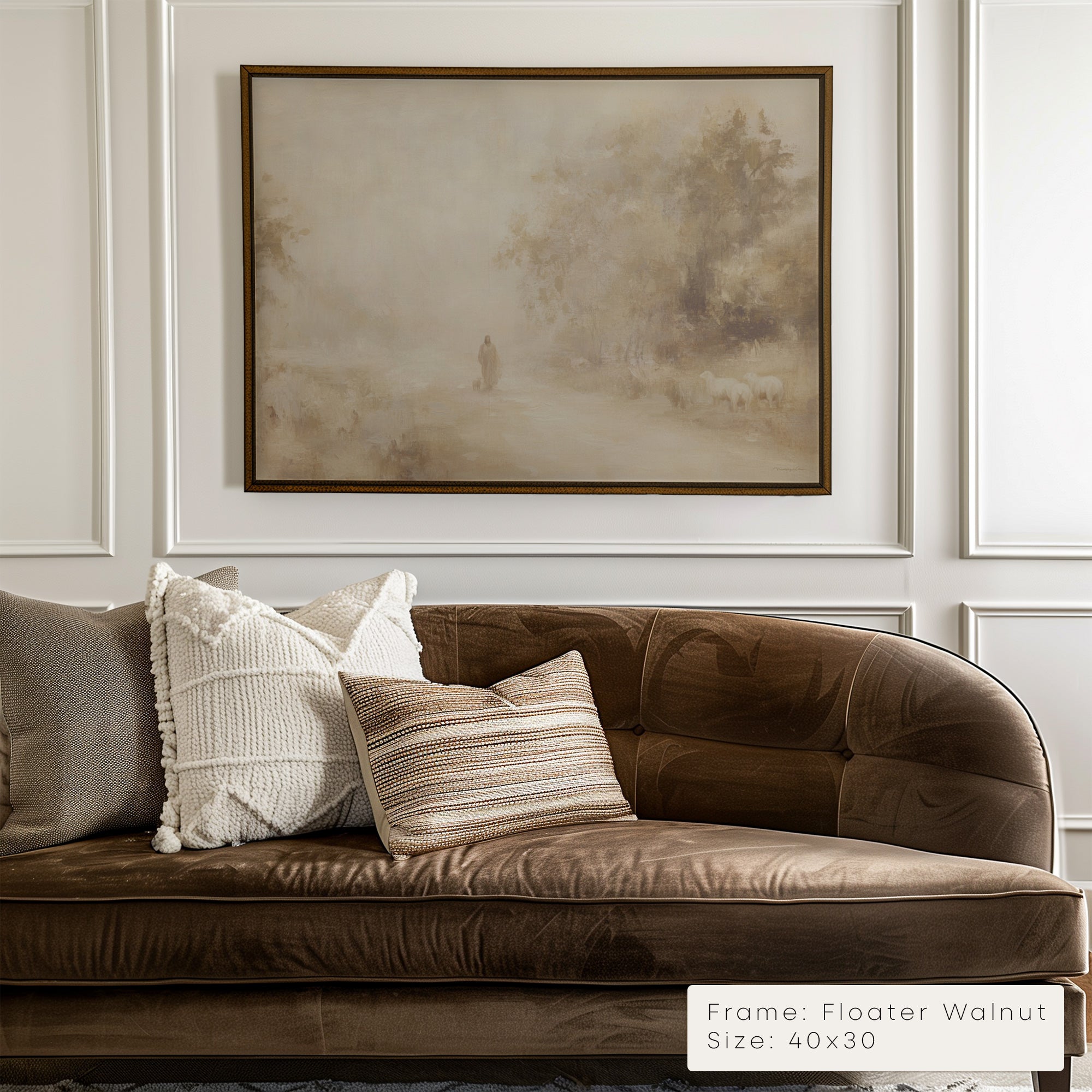 Brown velvet sofa with decorative pillows in a room with framed artwork on the wall.