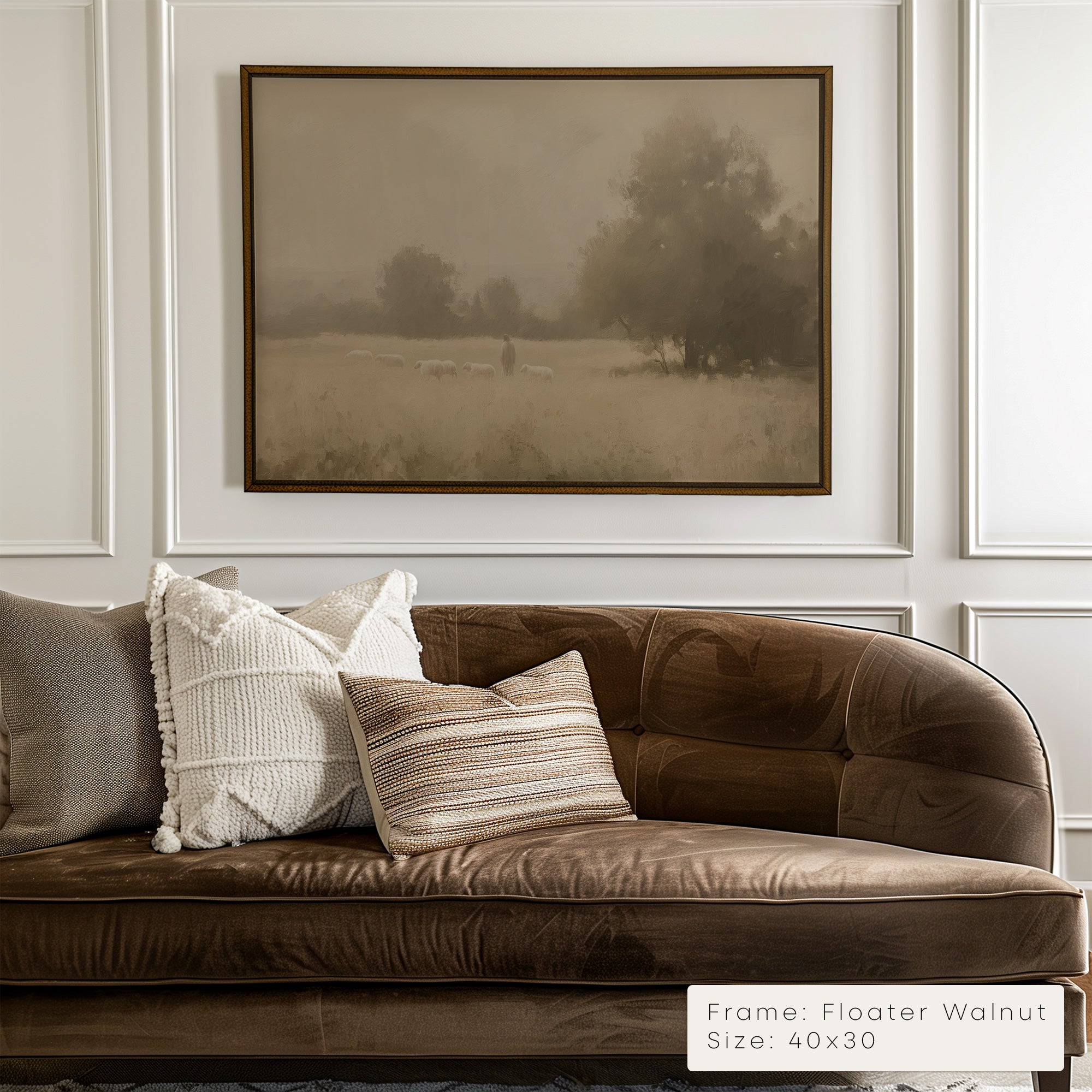 Brown sofa with decorative pillows in a room with a framed landscape painting on the wall.