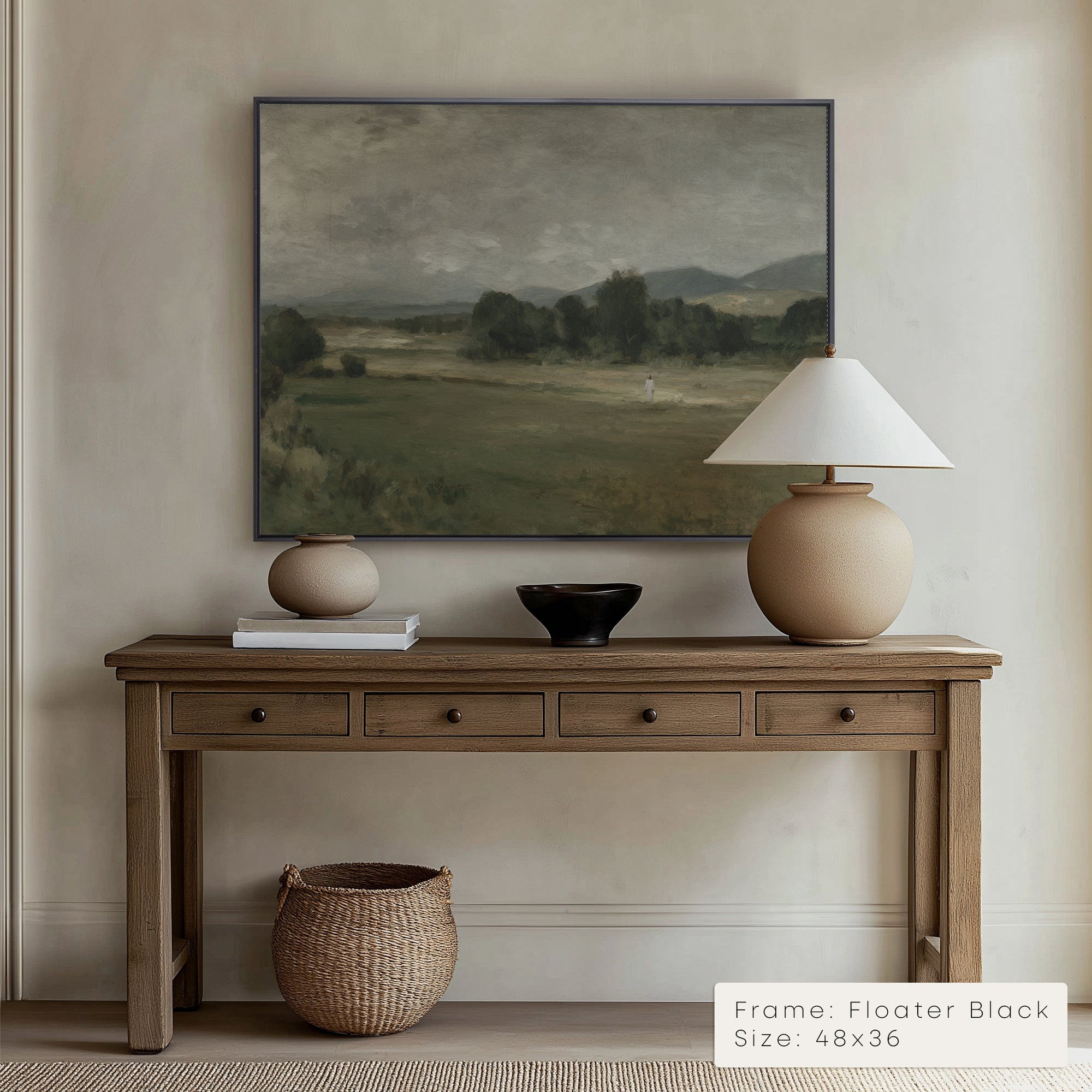 Wooden console table with decorative items against a wall with a landscape painting.