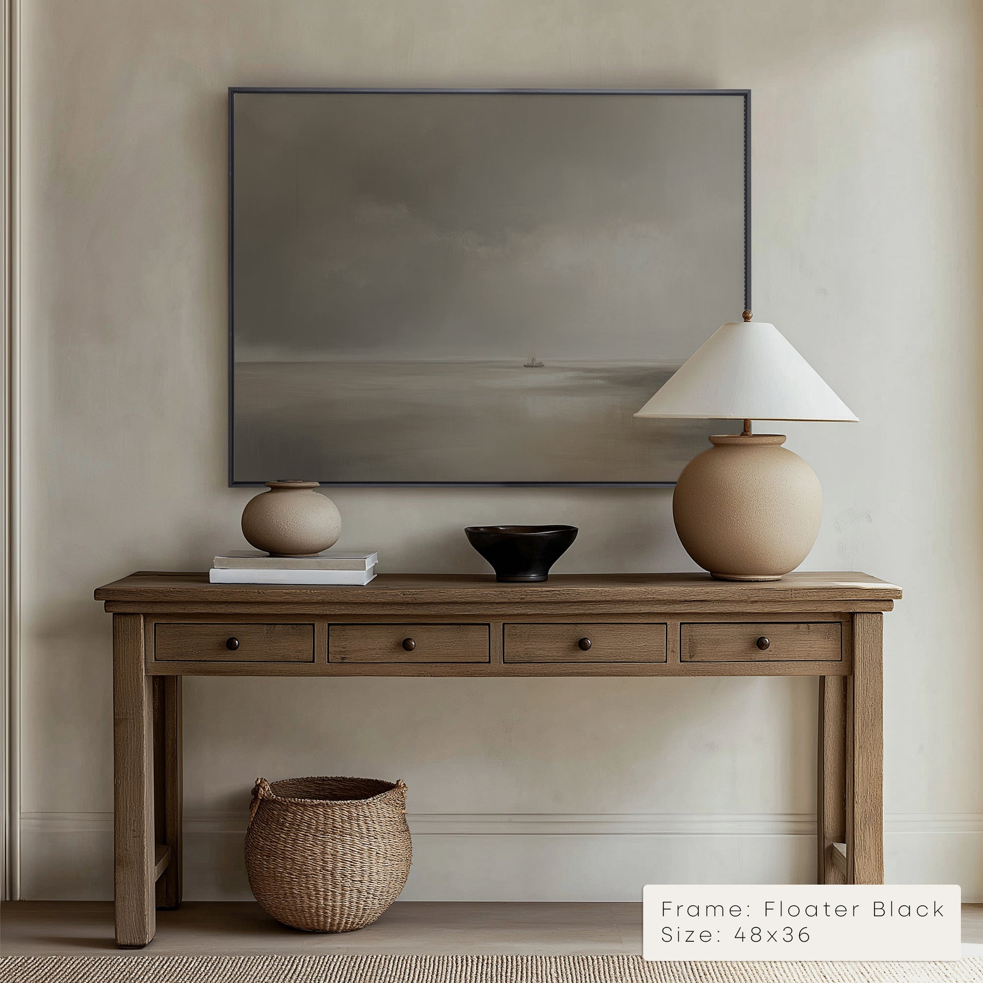 Wooden console table with decorative items against a beige wall with a framed artwork.