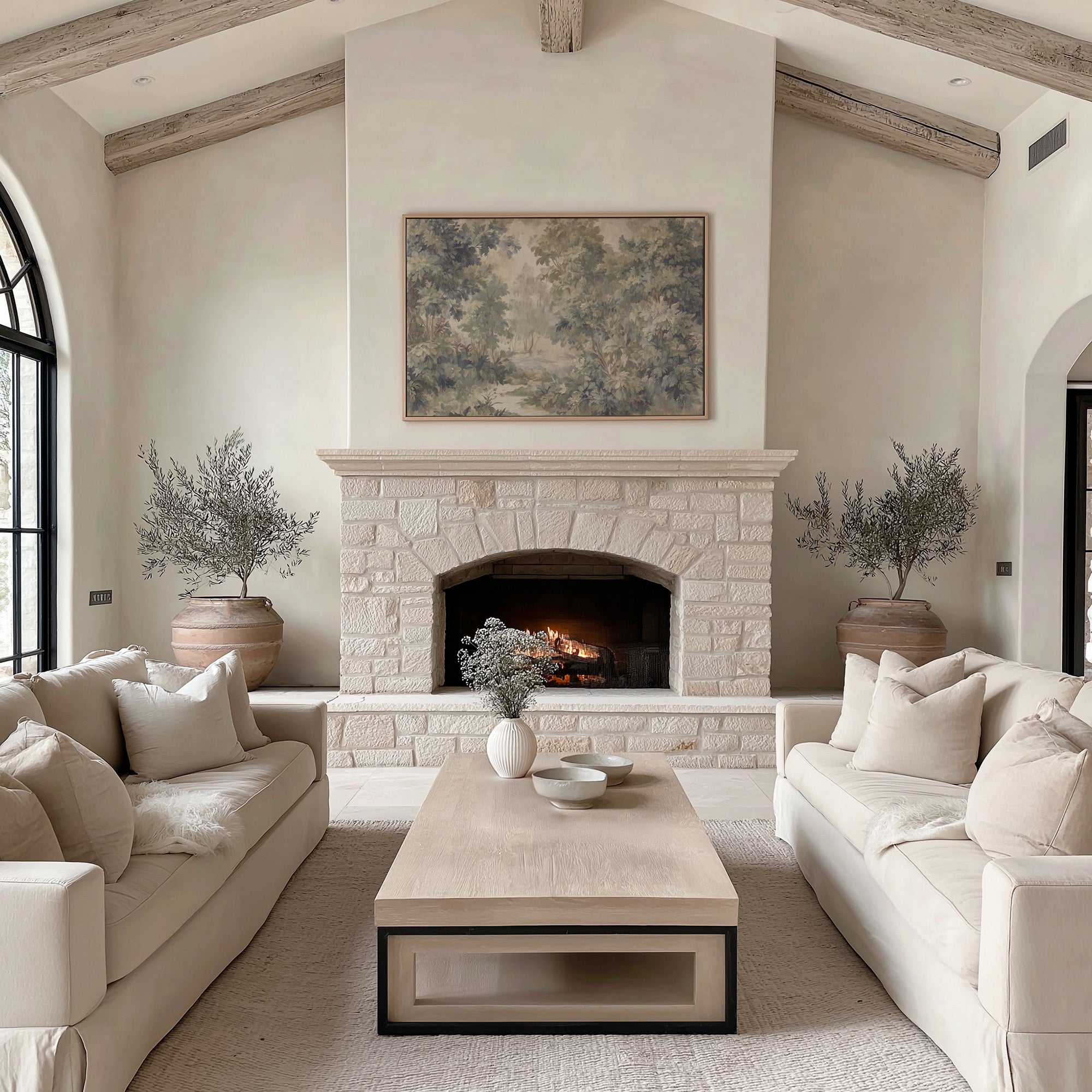 Living room with stone fireplace, beige sofas, and a coffee table.