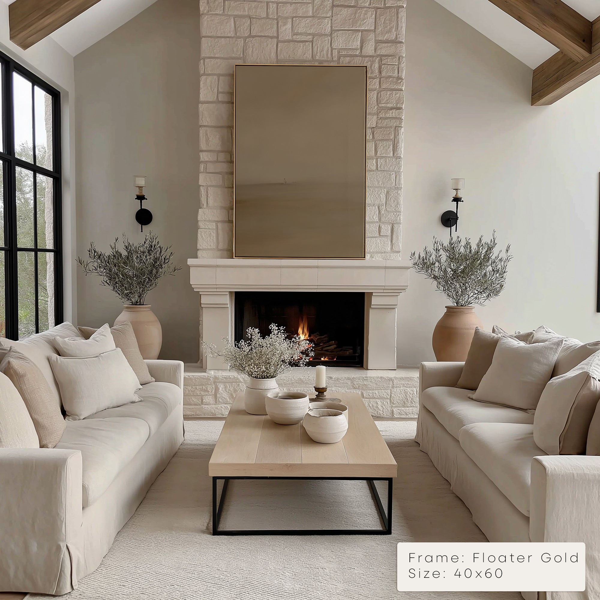 Modern living room with stone fireplace, beige sofas, and decorative elements.