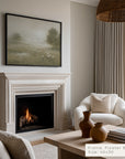 living room with fireplace, white armchair, and framed artwork on the wall. __lifestyleimage