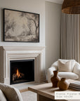 living room with fireplace, white armchair, and decorative vases.