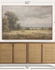 wooden sideboard with wicker doors and a framed landscape painting above it, showing dimensions. 