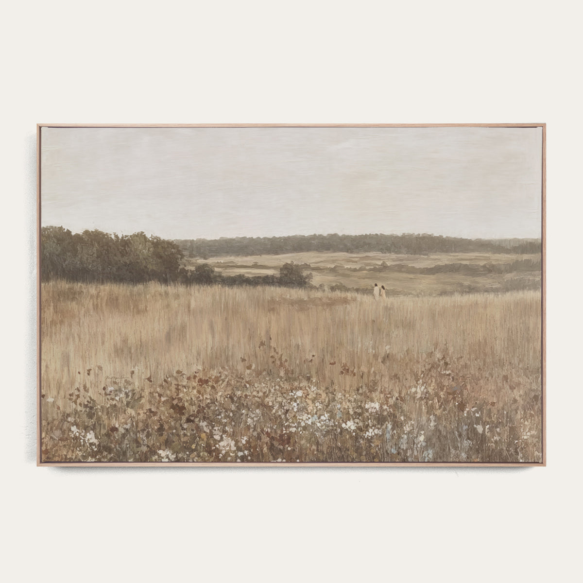 Framed landscape painting of a field with trees and sky. 