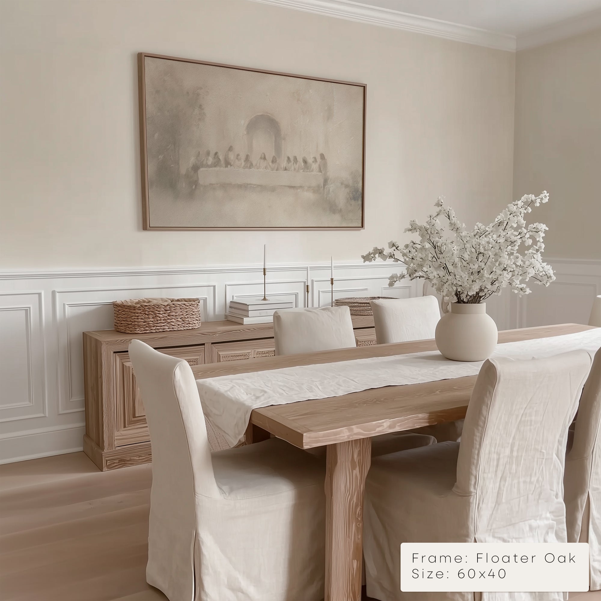 Dining room with wooden table, chairs, and a framed artwork on the wall.