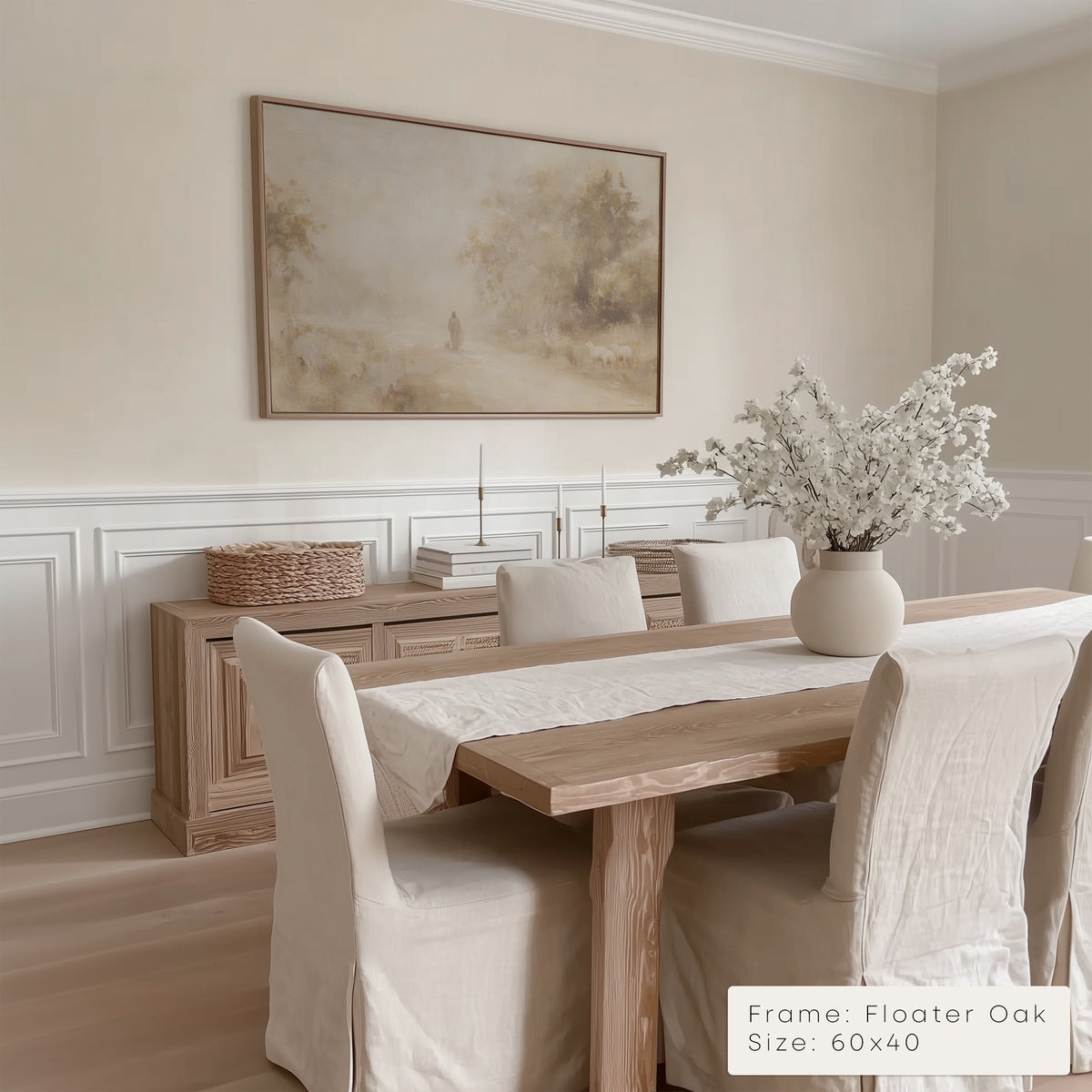 Dining room with wooden table, chairs, and a framed painting on the wall.