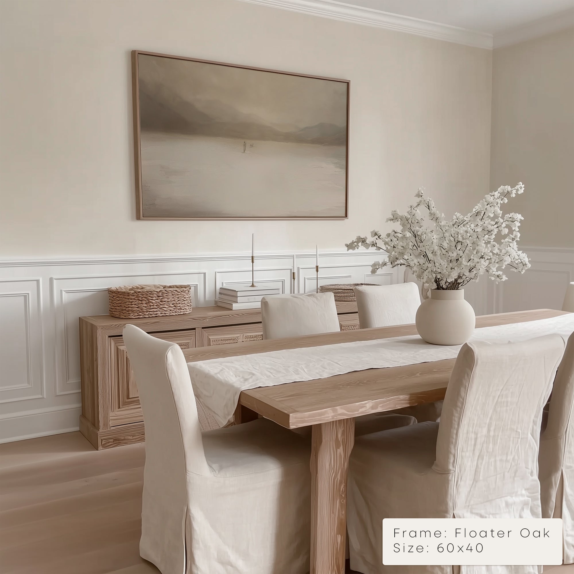 Dining room with wooden table, chairs, and a framed artwork on the wall.