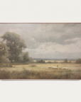 framed painting containing a landscape, 2 trees, and a shepherd with sheep. 