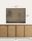 wooden sideboard with wicker doors and dimensions displayed above a framed landscape painting. 