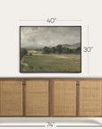 wooden sideboard with wicker doors and framed landscape painting above, with dimensions indicated. 