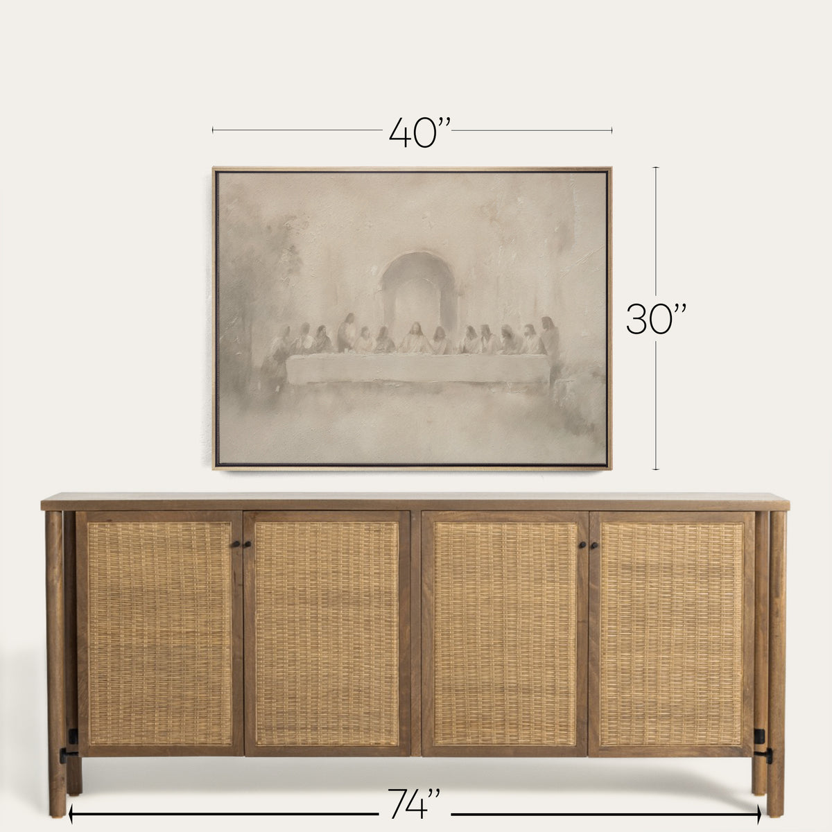 Wooden sideboard with rattan doors and framed artwork above on a white background 