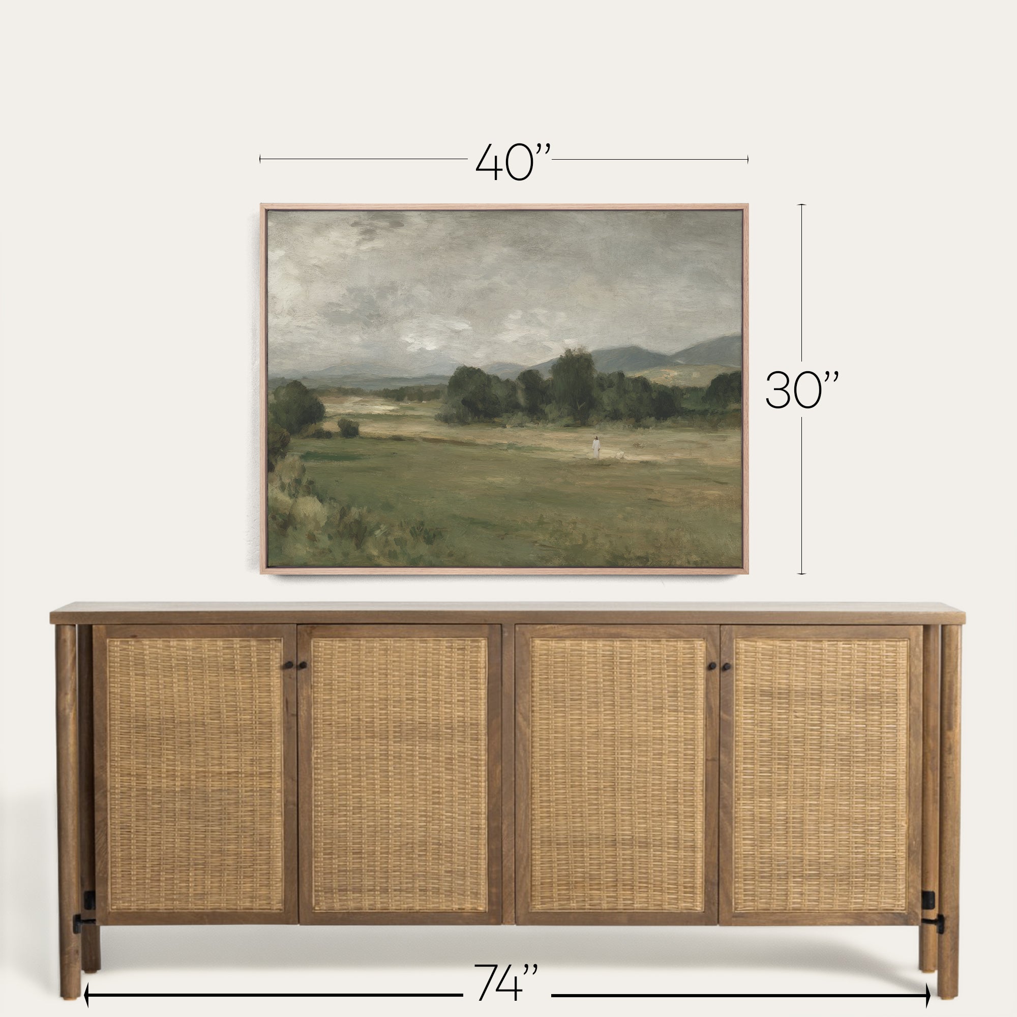 Wooden sideboard with wicker doors and framed landscape painting above, with dimensions indicated. 
