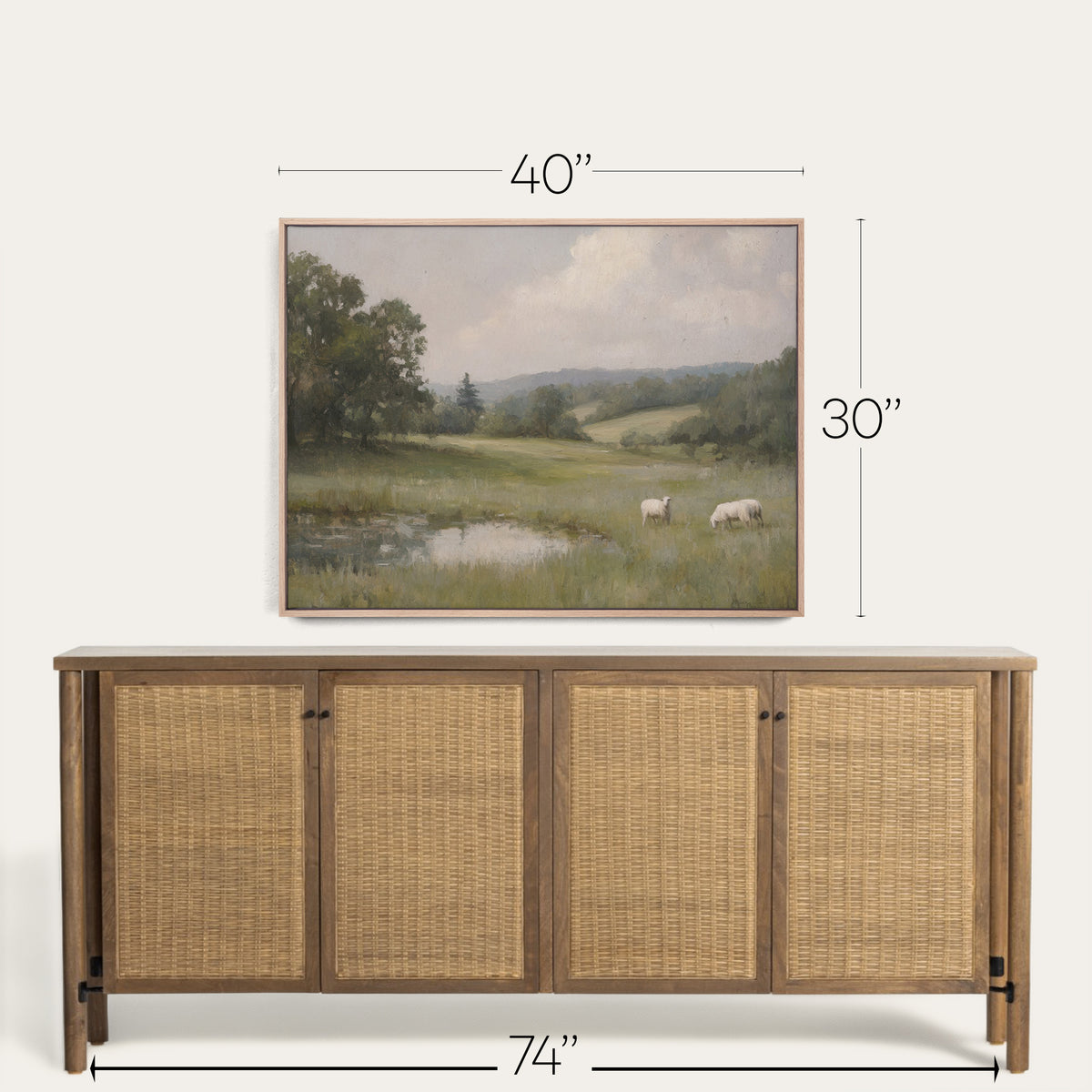 Wooden sideboard with wicker doors and a framed landscape painting above it, with dimensions displayed. 