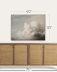 wooden sideboard with wicker doors and framed artwork above it on a white background 