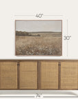 wooden sideboard with rattan doors and a framed landscape print above it, with dimensions displayed. 