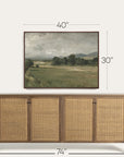 wooden sideboard with wicker doors and framed landscape painting above, with dimensions indicated. 