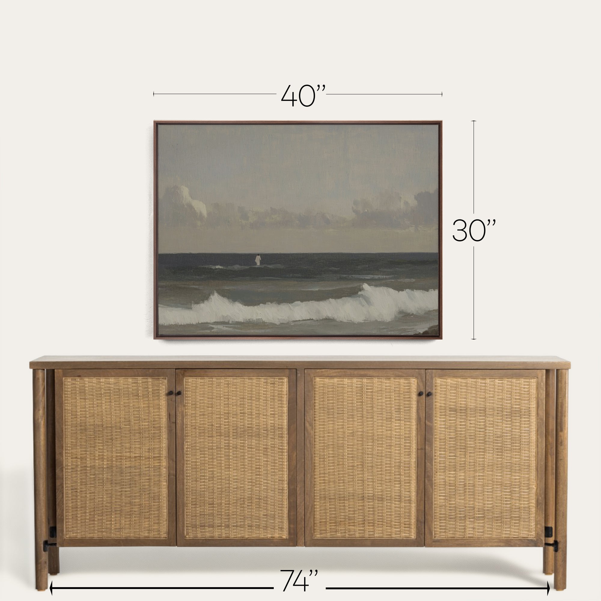 Wooden sideboard with wicker doors and framed artwork above it, showing dimensions. 