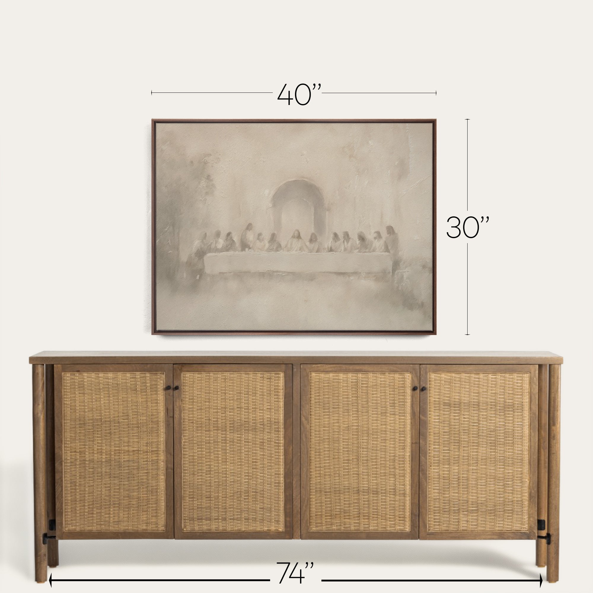 Wooden sideboard with wicker doors and framed artwork above on a white background 