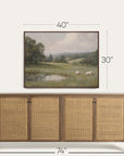 framed landscape painting above a wooden sideboard with dimensions indicated. 