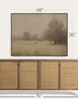 framed landscape print above a wooden sideboard with dimensions indicated. 