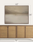 wooden sideboard with wicker doors and dimensions displayed above a framed landscape painting. 