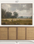 framed landscape painting above a wooden sideboard with dimensions displayed. 