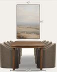 wooden dining table with four gray chairs and a landscape painting above on a white background 